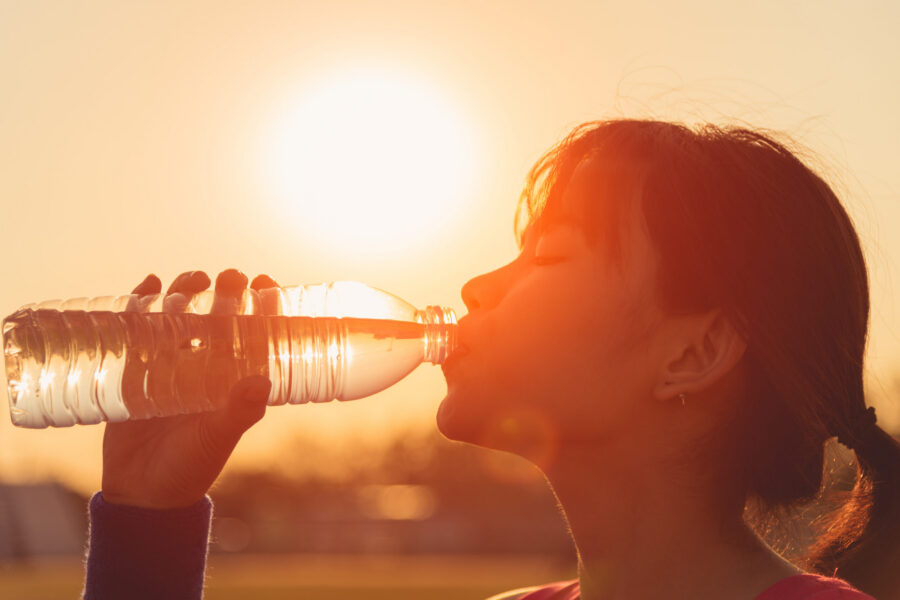 Summer health advice includes staying hydrated by drinking water in hot weather