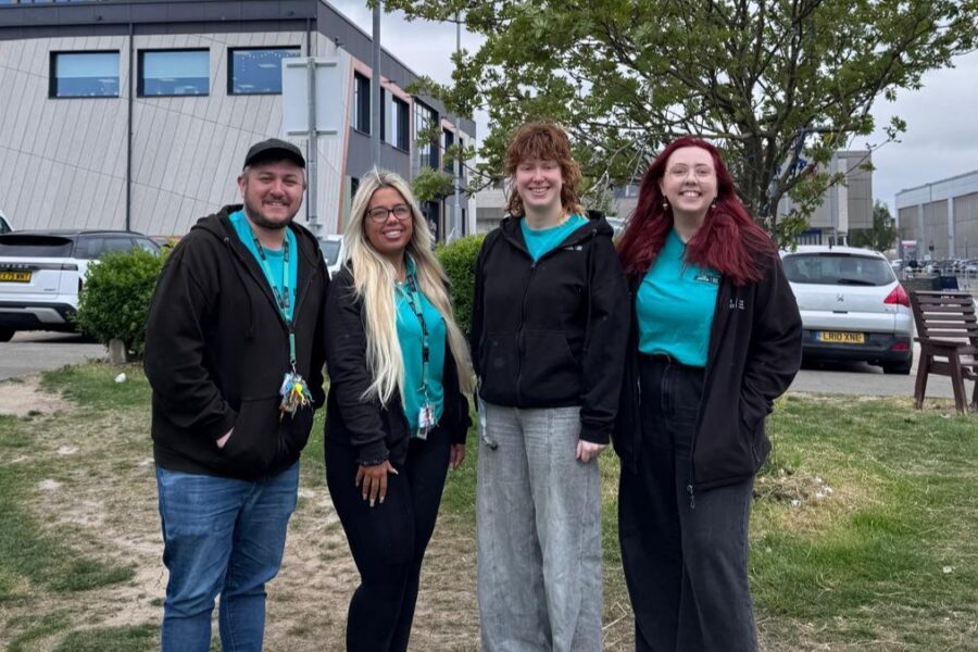 Youth worker team smiling at the camera