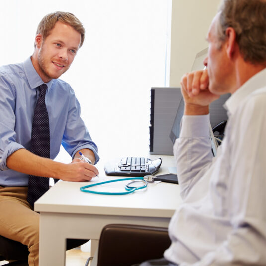Male doctors and patient