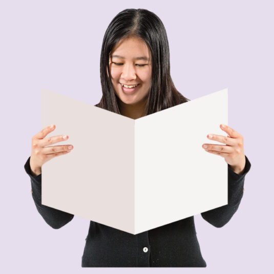 woman reading booklet