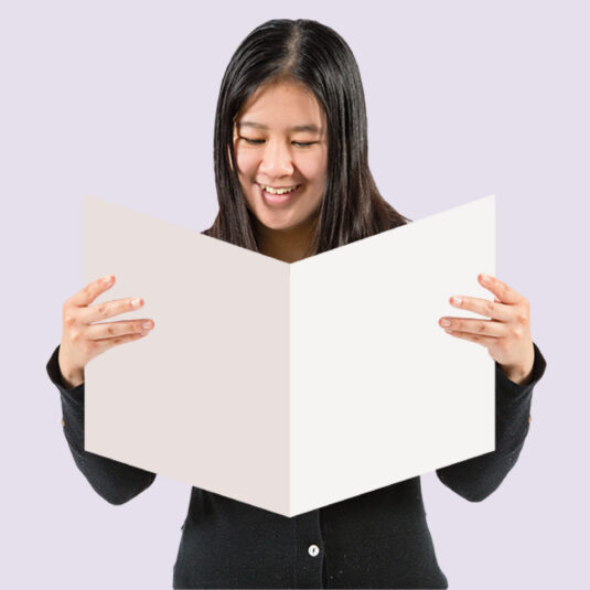 woman reading booklet