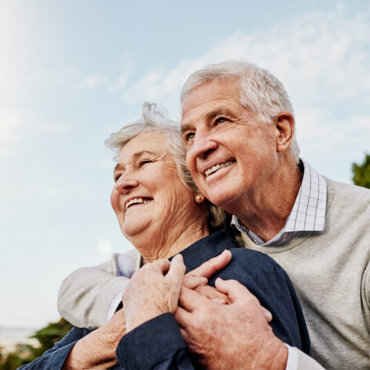Smiling elderly couple