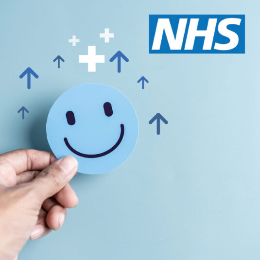 Smiley face with NHS logo and upward arrows representing improved patient care or NHS performance.