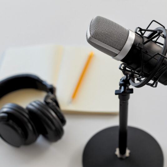 Microphone and headphones setup representing audio recording or podcast storytelling.