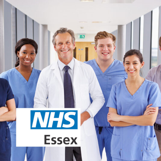 Healthcare team standing together in a hospital corridor.