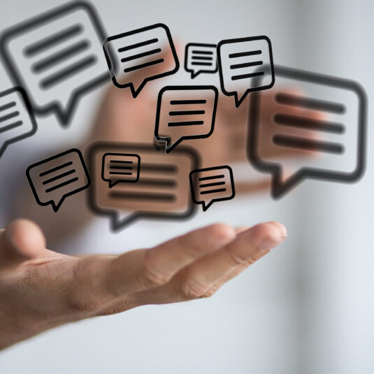 Speech bubble icons representing communication, feedback, or public engagement.