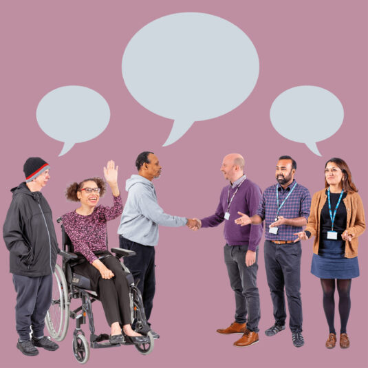 People with lived experience and staff engaging in discussion and collaboration.