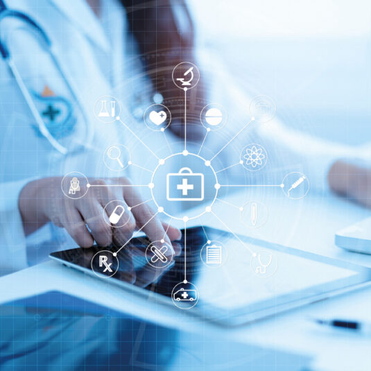 A laptop displaying an NHS online library webpage with the NHS logo and an open book icon. A person using a laptop with digital security icons, including a padlock and fingerprint, representing cybersecurity and data protection. A healthcare professional using a tablet with digital medical icons displayed, representing healthcare technology and digital health services.