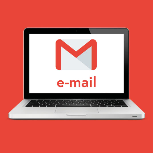 A laptop displaying an email icon on screen.