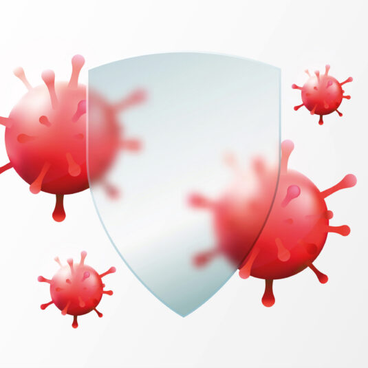 Illustration of a protective shield blocking virus particles, representing immunity or protection against infection.
