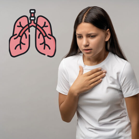 Person holding their chest with a lungs icon beside them, indicating breathing difficulties or chest-related symptoms that may need medical attention.