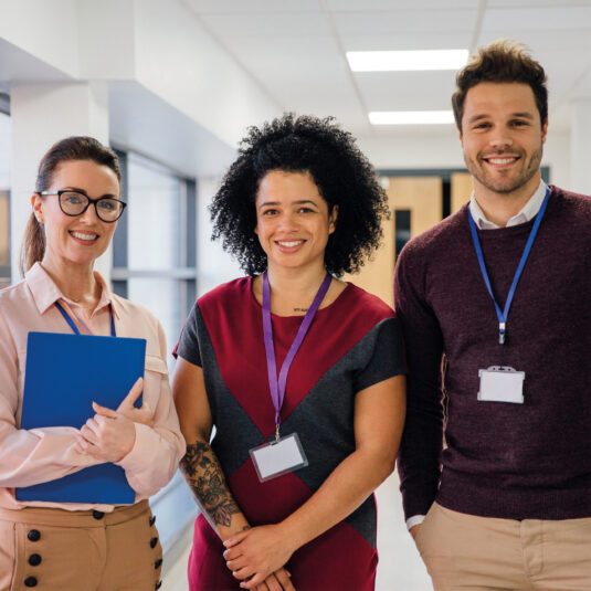 Group of teachers wearing ID badges
