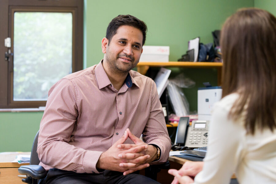 Doctor talking to a patient in a GP practice.