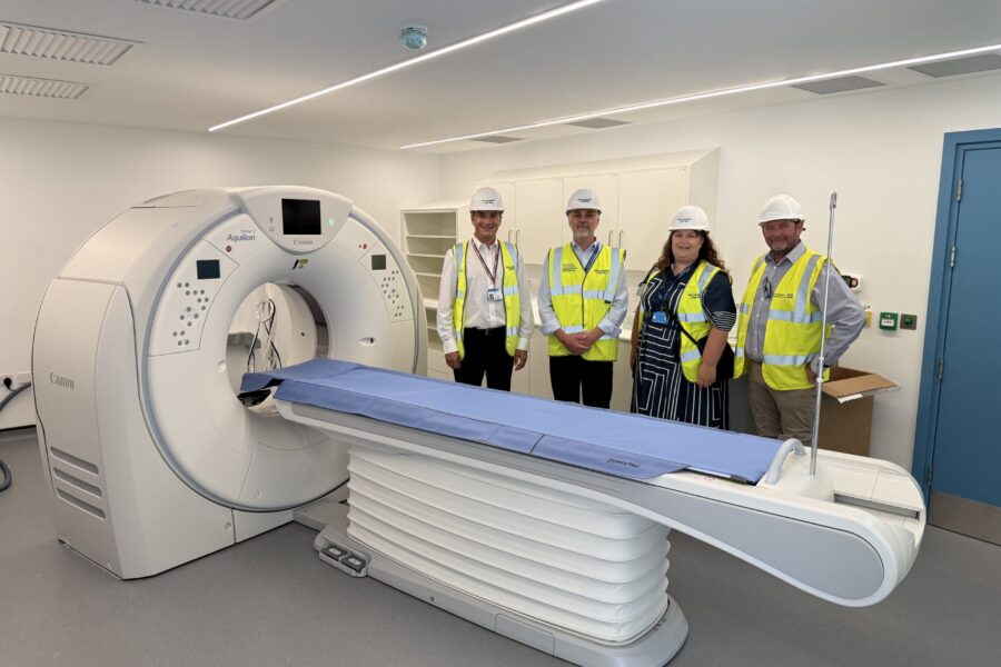 Checking out a new CT scanner at the forthcoming Braintree Community Diagnostic Centre are (left to right) Adam Sewell-Jones, Group Chief Executive; Jamie Andrews, Director of Capital and Strategy; Natasha Kerrigan, Chief Estates and Infrastructure Officer; and Nick Purdie, Senior Project Manage